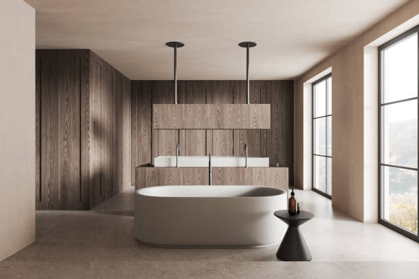 istock Stylish hotel bathroom interior with double sink and tub, panoramic window 2168581365