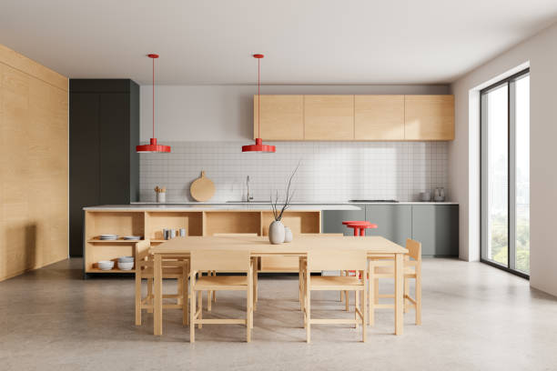 istock Modern home kitchen interior with bar island and eating table near window 2168581549