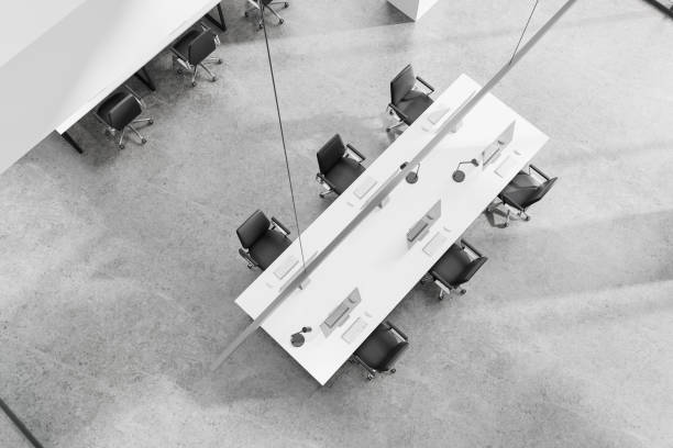 istock Top view of stylish office interior with pc monitors and chairs, workplace 2168582264
