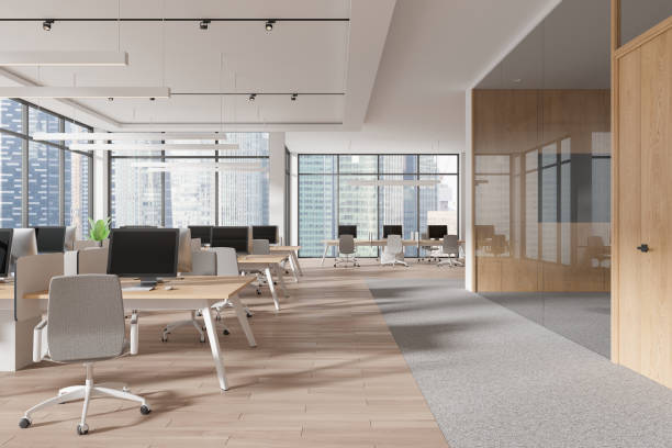 istock Modern open-plan office space with wood and glass elements, bright lighting, cityscape background, concept of contemporary workspace. 3D Rendering 2168582551
