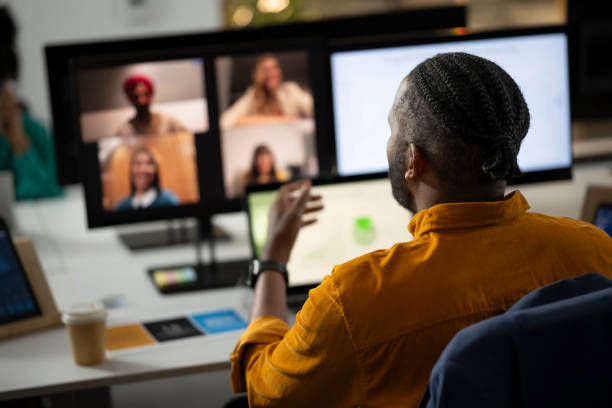 istock Businessman talking to colleagues 2168582624