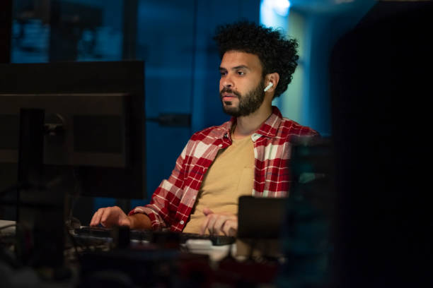 istock Young businessman working late in office 2168582703
