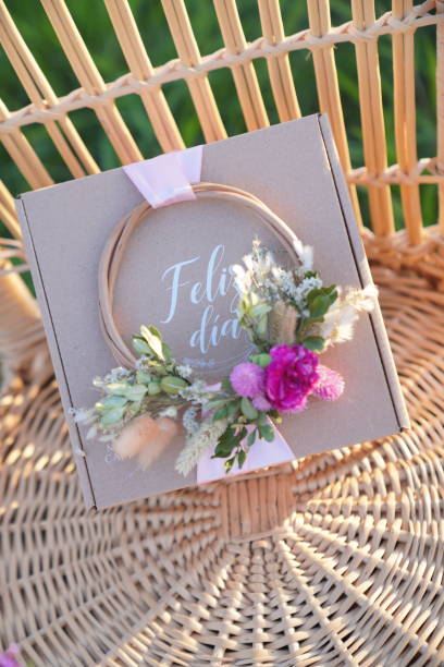 istock Gift box, on wicker chair in the field. 2168582970