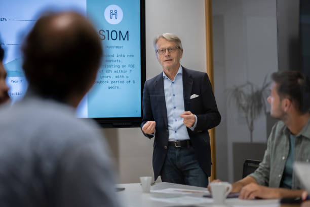 istock Businessman talking to colleagues 2168583197
