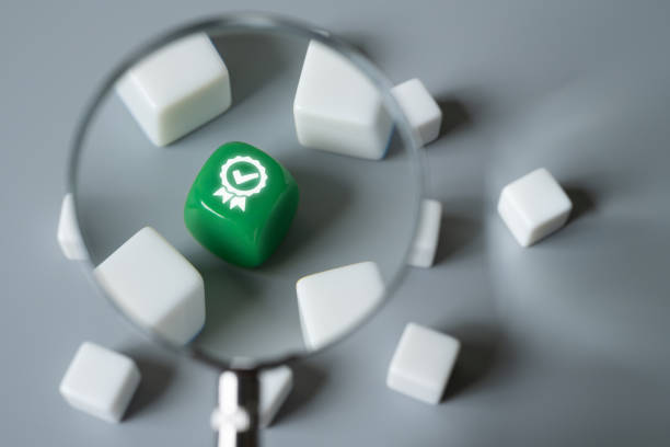 istock magnifier zoom into green cube shape with certificate approved green icon. describe audit and quality control concept. ISO certification product and process quality improvement. 2168586751