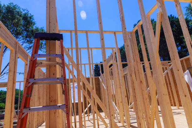 istock Timber studs support beams in unfinished interior of a newly built house 2168588400