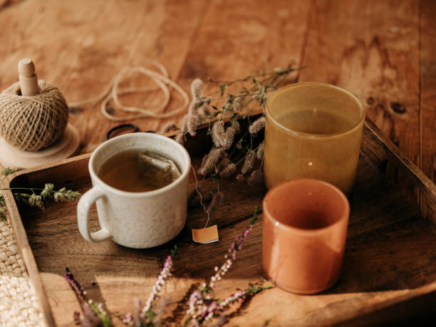 istock Autum tea cup still life with heather and hares foot clover 2168597537