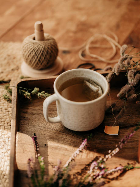 istock Autum tea cup still life with heather and hares foot clover 2168597590