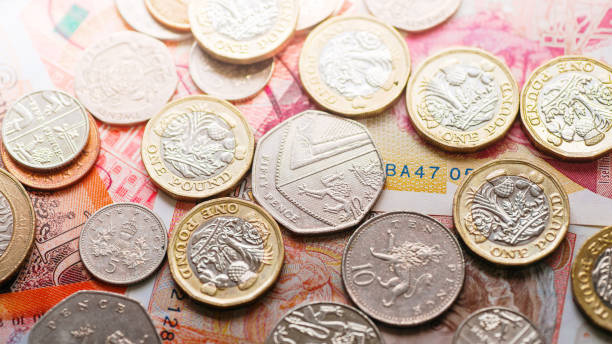 istock Great Britain pound coins and banknotes 2168597759