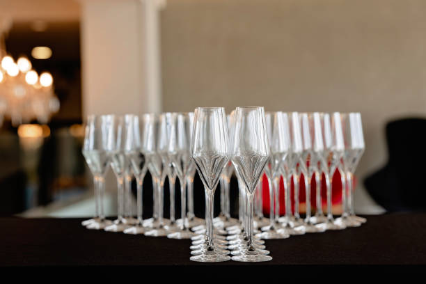 istock Champagne glasses in a row prepared for an event. Banquet setting 2168599699