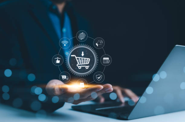 istock E-commerce technology concept. A person holding shopping cart icon with e-commerce symbols represents online shopping technology and digital marketing. customer service, delivery, reach, satisfaction, 2168600962