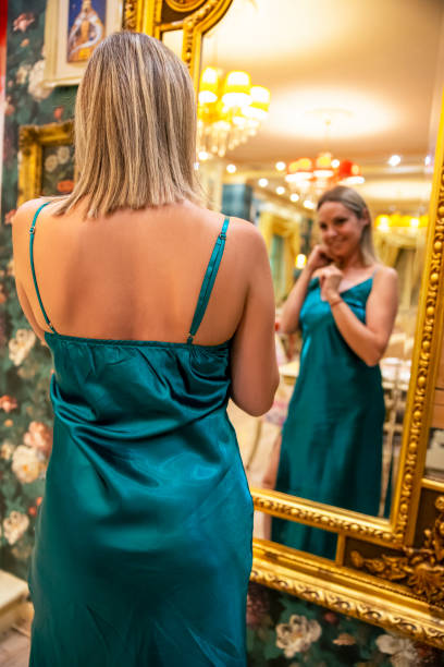 istock Woman looking herself in the mirror 2168601454