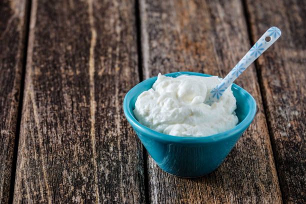 istock Skyr in a blue bowl on a wooden table 2168606280