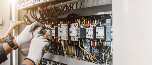 istock Electrician engineer tests electrical installations and wires on relay protection system. 2168608422