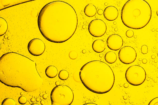 istock Yellow macro bubble texture. Different colored bubbles of oil and water. 2168609259
