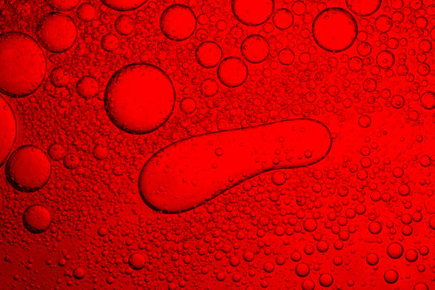 istock Red macro drink bubble texture,Macro photo. Oil bubbles on a water surface. Red background. Red color in water and oil. 2168609606