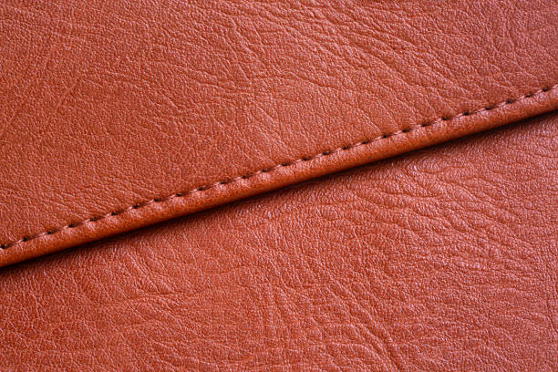 istock Brown macro leather texture, Brown synthetic leather texture, Brown leather texture background and seams, 2168609617