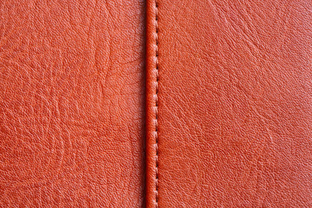 istock Brown macro leather texture, Brown synthetic leather texture, Brown leather texture background and seams, 2168609618