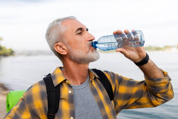 istock Senior Man Hydrating During Hiking Break 2168611728