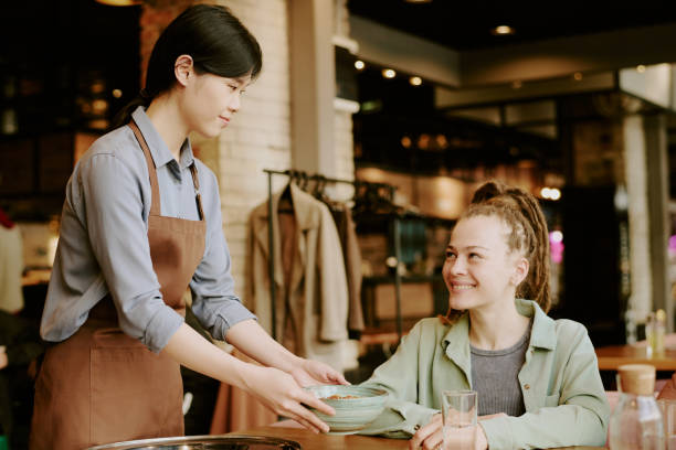 istock Serving Customer in Cozy Cafe with Warm Ambiance 2168616694