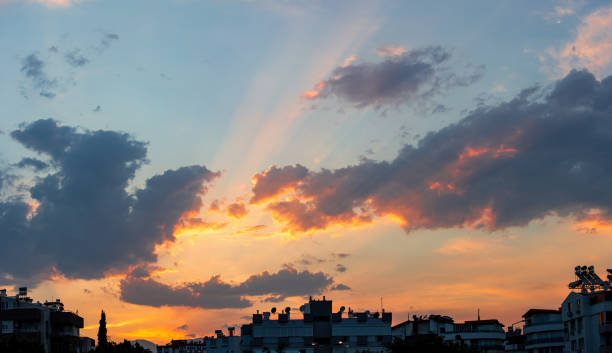 Sky clouds sunset cloudscape sun beams orange colors sky with clouds. Multiple shots merge in one large image. Shot in Antalya Turkey