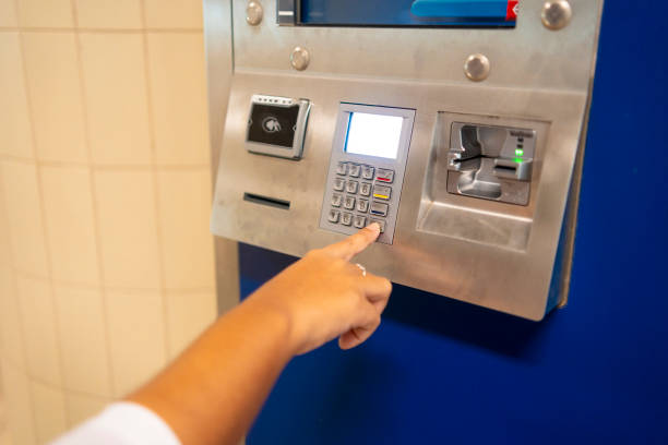 istock Woman at train station buying ticket 2168619532
