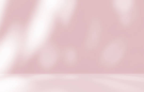 istock Empty pink colour room studio with sunlight effect shadow on the floor and wall for product presentation. 2168620162