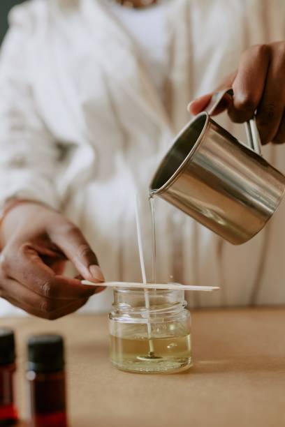 istock Pouring Liquid into Candle Jar 2168621354