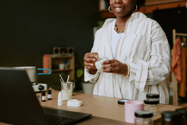 istock Smiling Woman Holding Mug in Cozy Workspace 2168622724