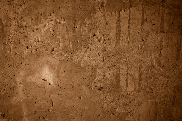 istock Cement wall texture in brown color 2168625025