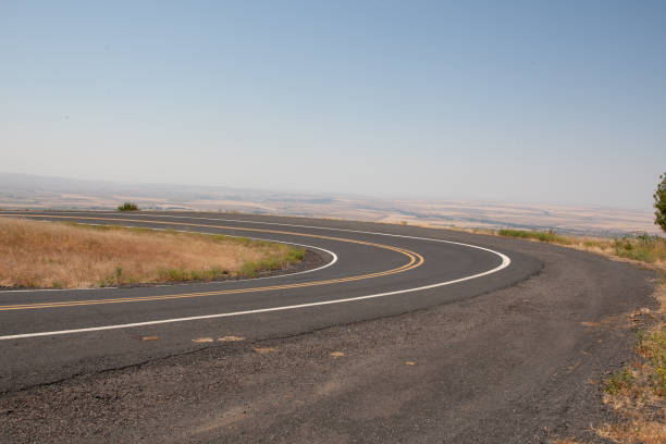 istock A winding road meanders through Pendleton, Oregon, tracing the contours of its rolling hills and offering stunning, scenic views of the picturesque landscape. 2168628080