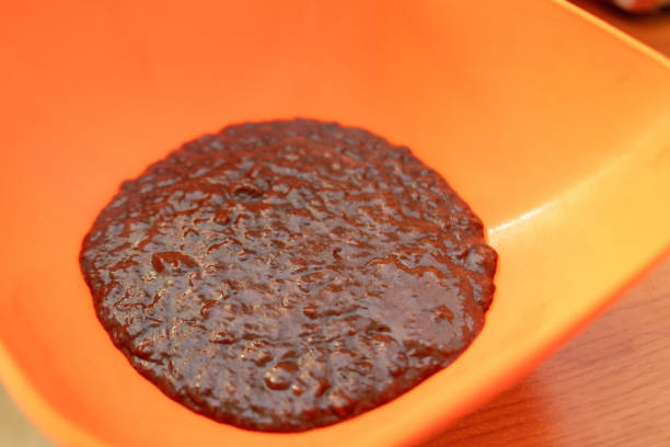vivid orange bowl cradles ground beef liver, showcasing a unique, liquid-like texture. This image evokes culinary creativity and highlights the rich, nutrient-dense nature of offal