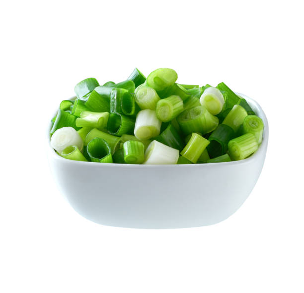 istock Chopped green onion in a ceramic bowl isolated on white background. 2168630699