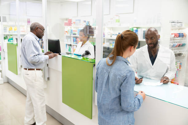 istock Customers getting prescription medicine at pharmacy counter 2168632921