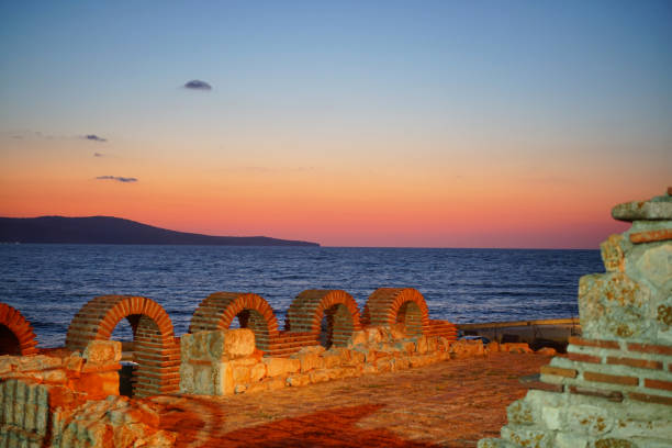 Minutes before sunrise over Emona cape on Black sea visible from the old town Nessebar, Burgas province, Bulgaria.