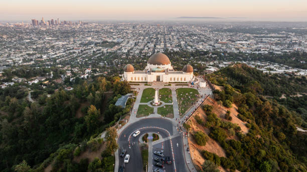 Griffith Park Observatory Overlooking an LA Sunset - Aerial View