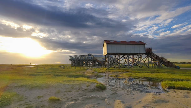istock Pile dwellings in Sankt Peter-Ording at sunset 2168634092