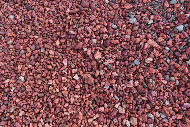 istock Red volcanic gravel forming a textured background 2168636458
