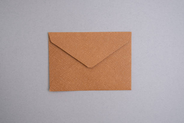 istock Paper envelopes on a light background. New mail, write a message. Send and receive mail. Postal delivery service. Empty envelope, empty space. Communication with people, paperwork. Envelope close-up 2168640327