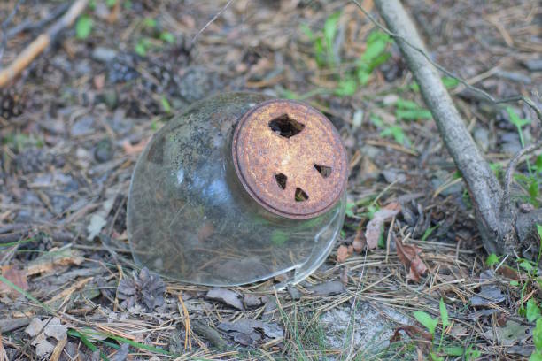 istock one large gray broken glass jar with a hole closed brown rusty metal lid 2168640707
