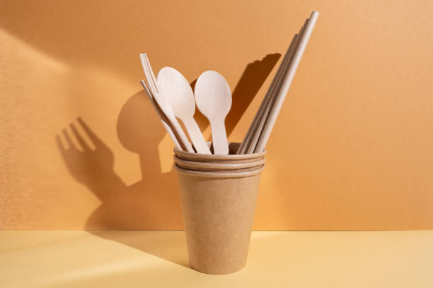 istock Kraft paper tableware: cups, food boxes, isolated on a light background. A set of various disposable tableware. Recycling and zero waste concept. Mock up 2168640851