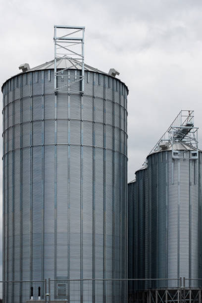istock Steel grain silo against a dramatic, cloudy sky. 2168641744