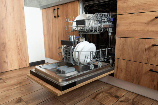 istock kitchen with built-in open dishwasher with clean dishes 2168643386