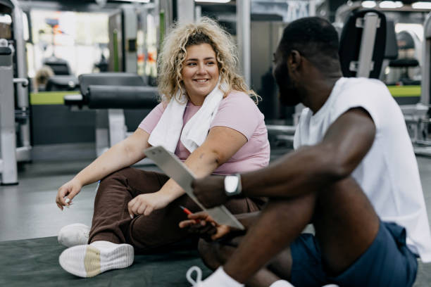 istock Finishing a workout with smiles and a discussion, gym fun 2168645875