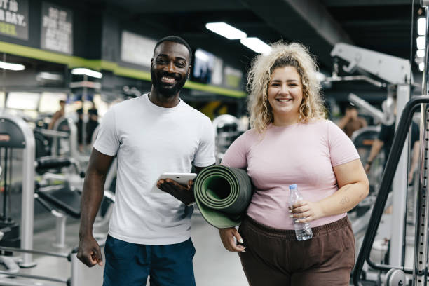 istock After workout pose with gym mat and water bottle. 2168646046