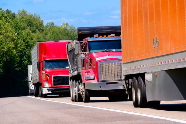 istock Stacked Convoy of Heavy Trucks On The Interstate Highway 2168652813