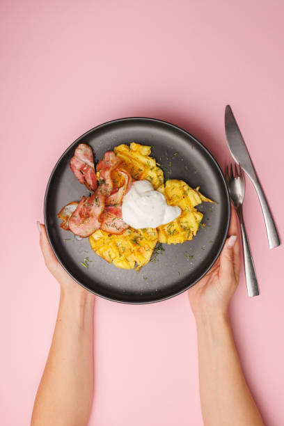 istock Baked potatoes with bacon, hearty breakfast, lunch, brunch. 2168660054