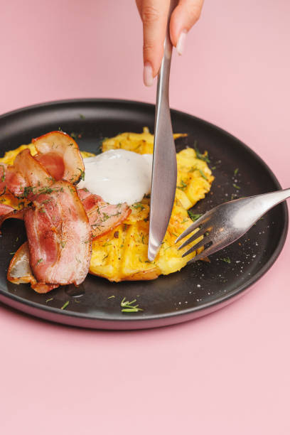 istock Baked potatoes with bacon, hearty breakfast, lunch, brunch. 2168660066