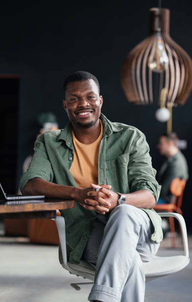 istock Young Professional Smiling in a Modern Office Environment 2168660336