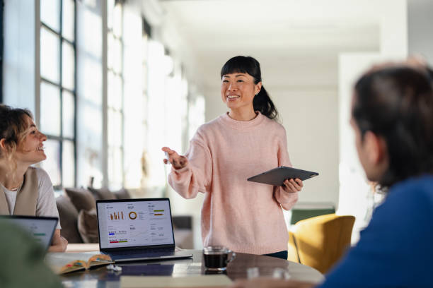 istock Diverse Team of Professionals Collaborating in a Modern Office Environment 2168660366